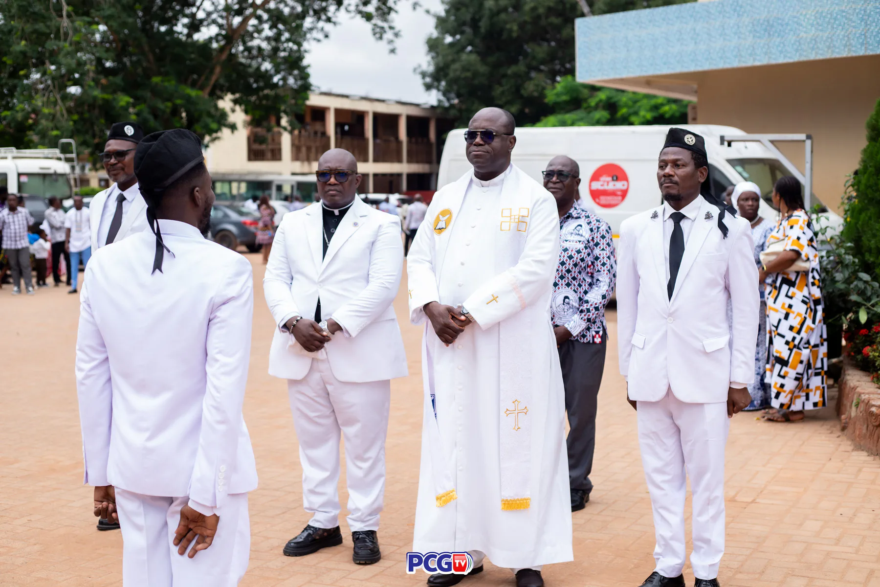 Presbyterian leaders in white standing together outdoors