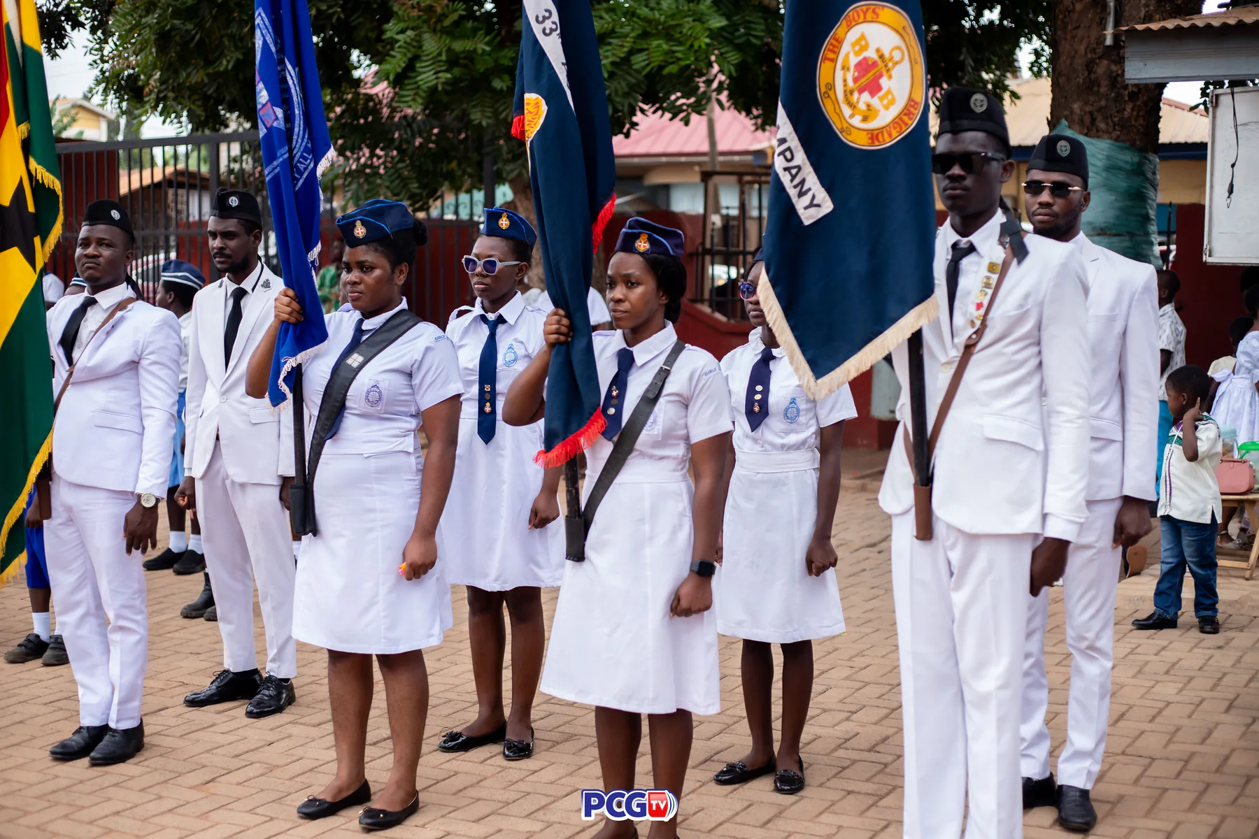 Presbyterian youth brigade members standing with ceremonial flags