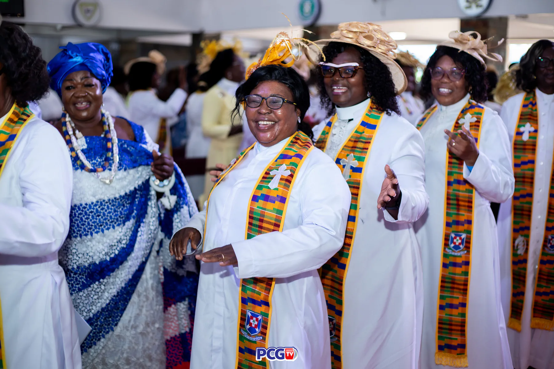 Female Presbyterian ministers smiling and dancing together