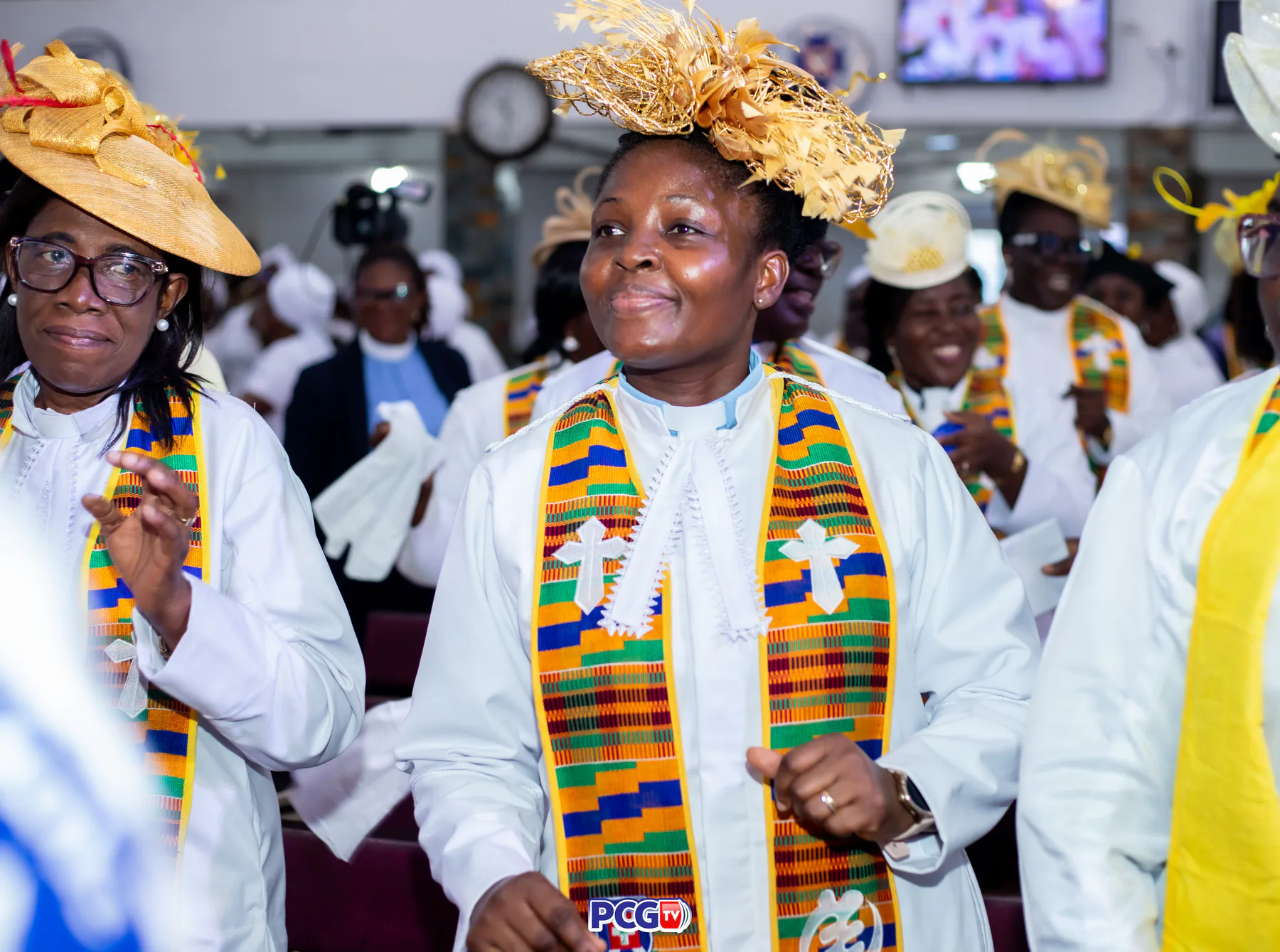A female Presbyterian minister smiling during worship