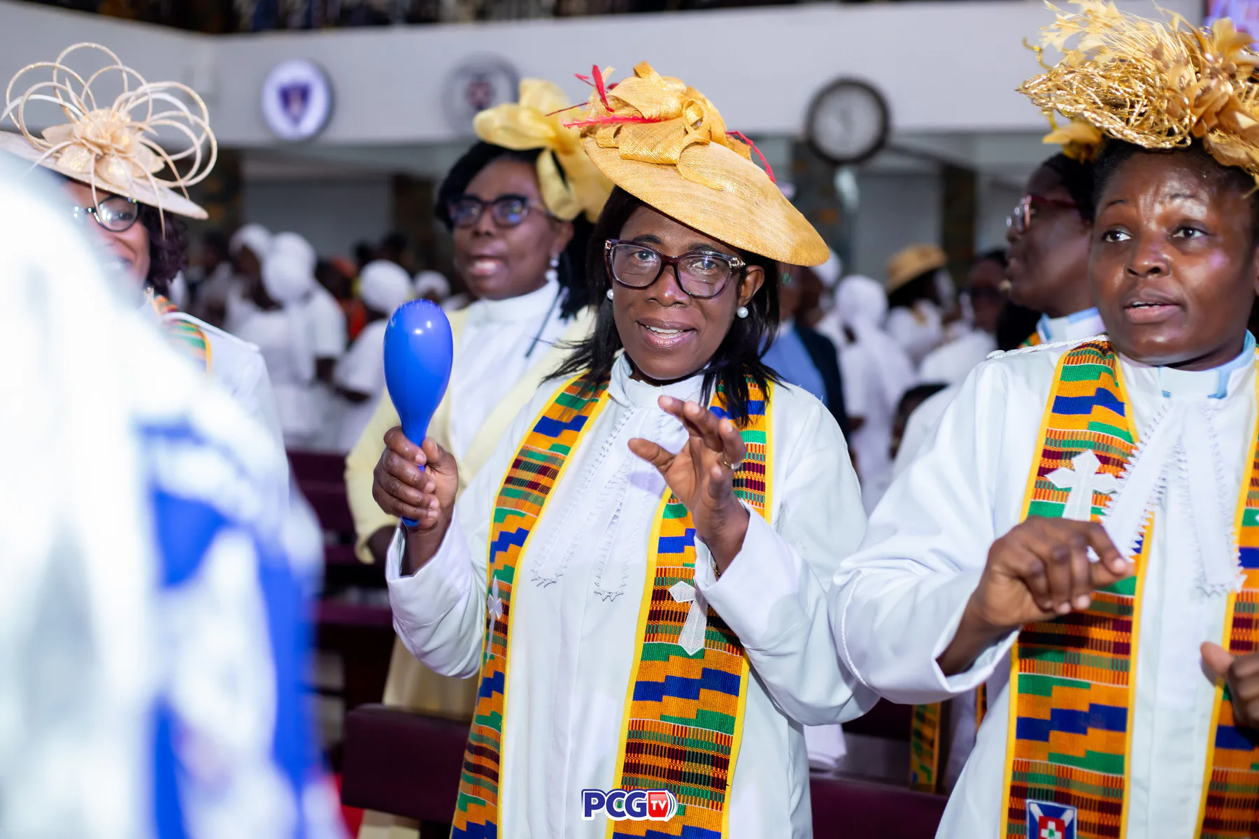 Female Presbyterian ministers singing with musical shakers