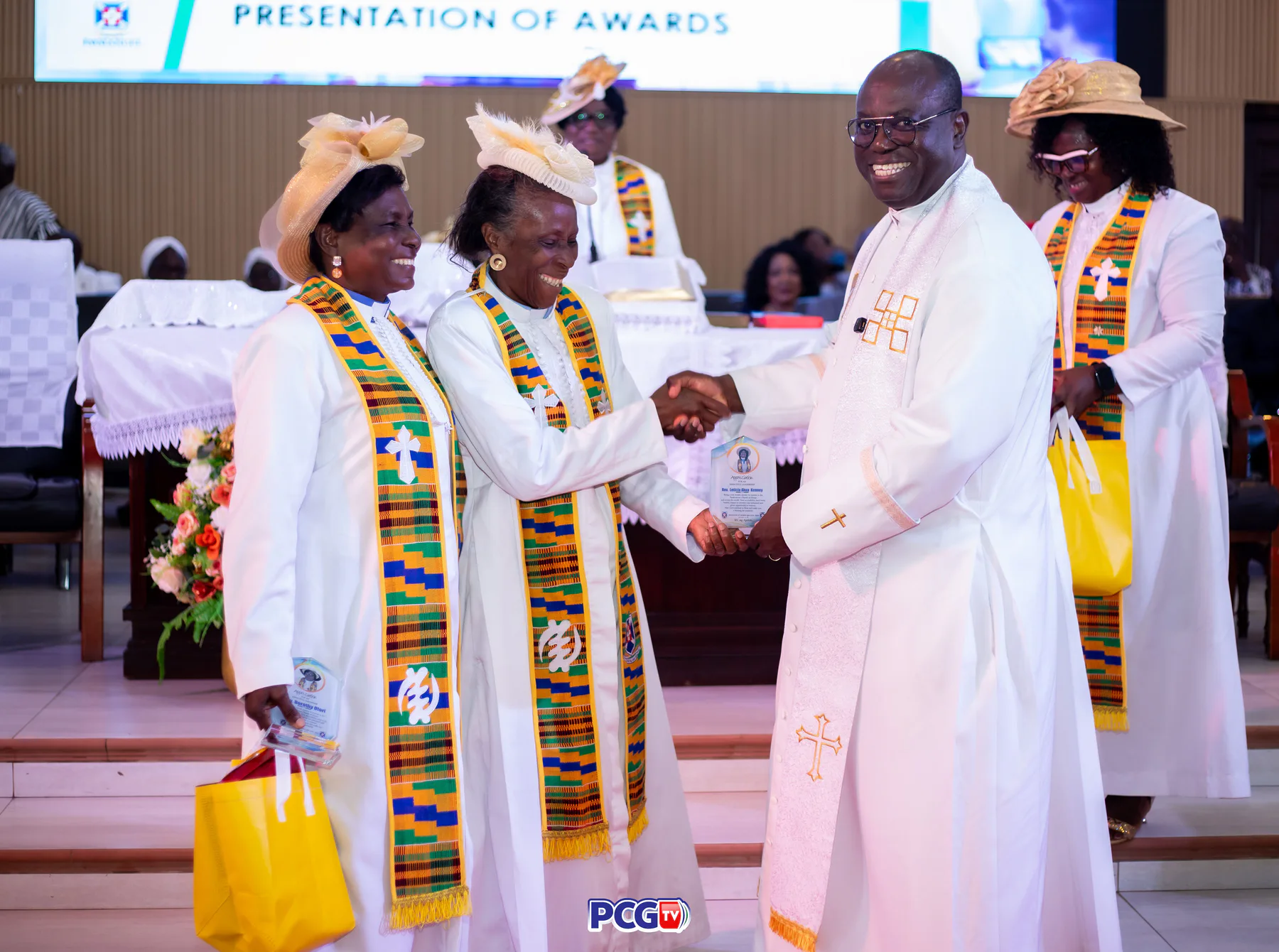 Church leaders presenting an award during a Presbyterian service