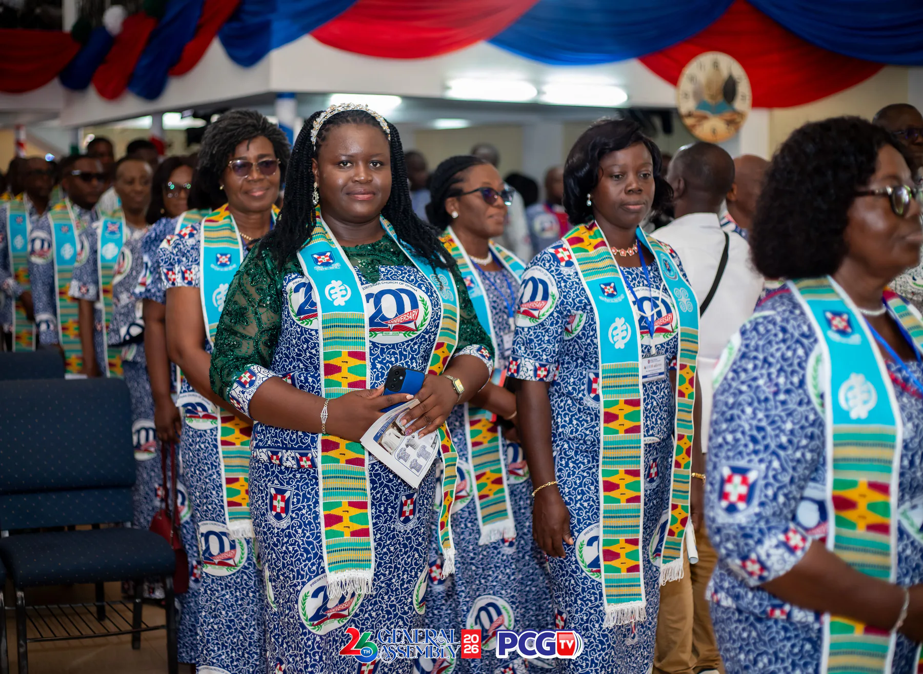 A line of Presbyterian delegates wearing anniversary cloth