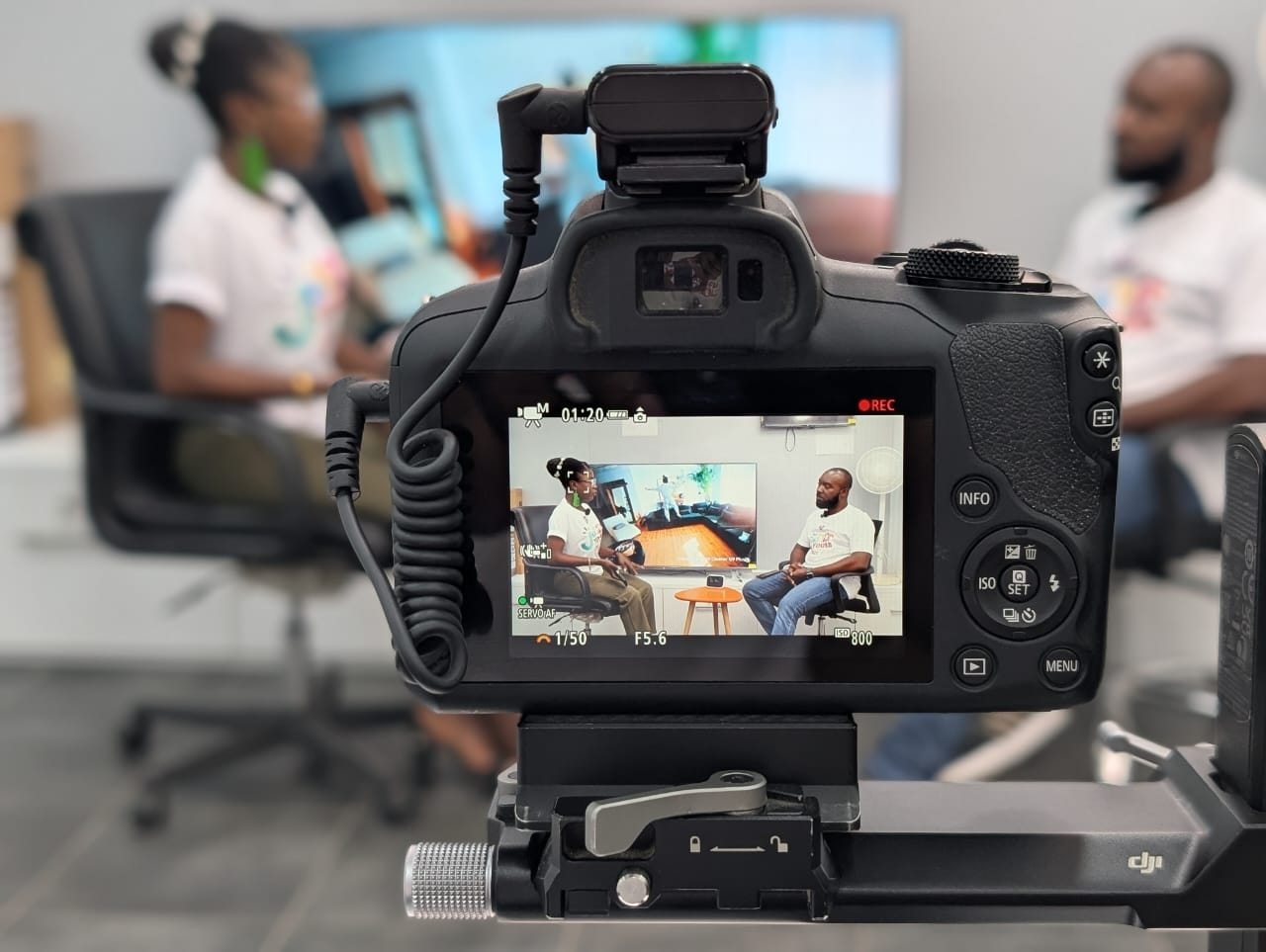A camera recording an interview for The Bridge